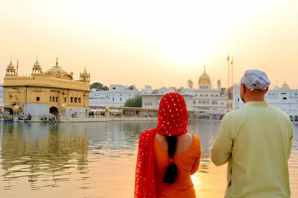 Young couple cover thier head with cloths visit at Golden temple Amritsar