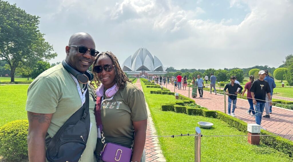 "Couple posing in front of Lotus Temple during Golden Triangle tour."