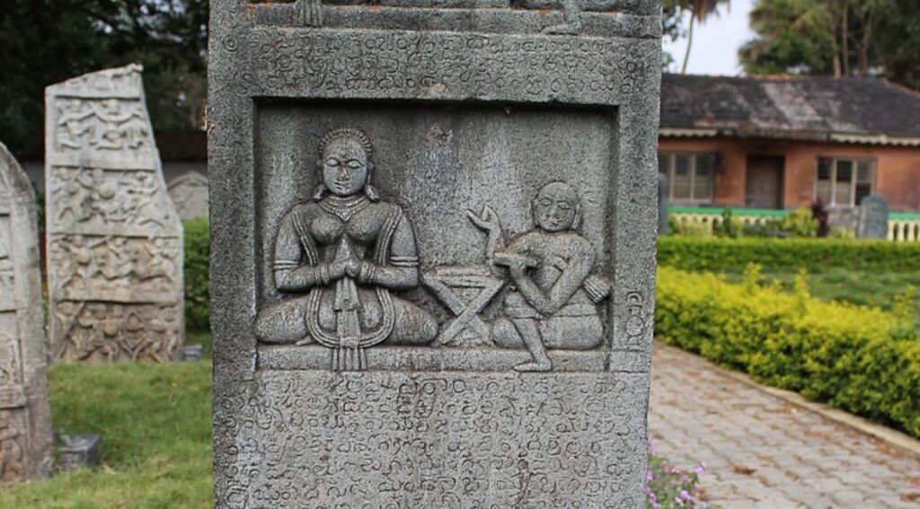 "Statue of a Jain figure adorned in traditional attire, symbolizing Jainism's influence on Indian culture."