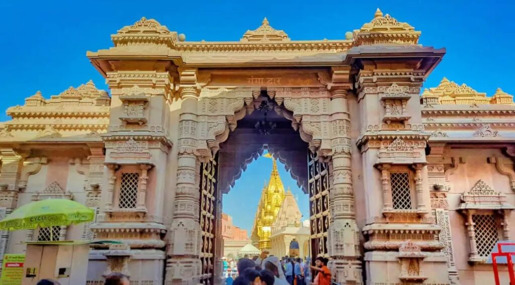 The grand entrance gate of Ganga Dwar, adorned with intricate carvings and traditional designs, welcoming visitors to the spiritual heart of nature